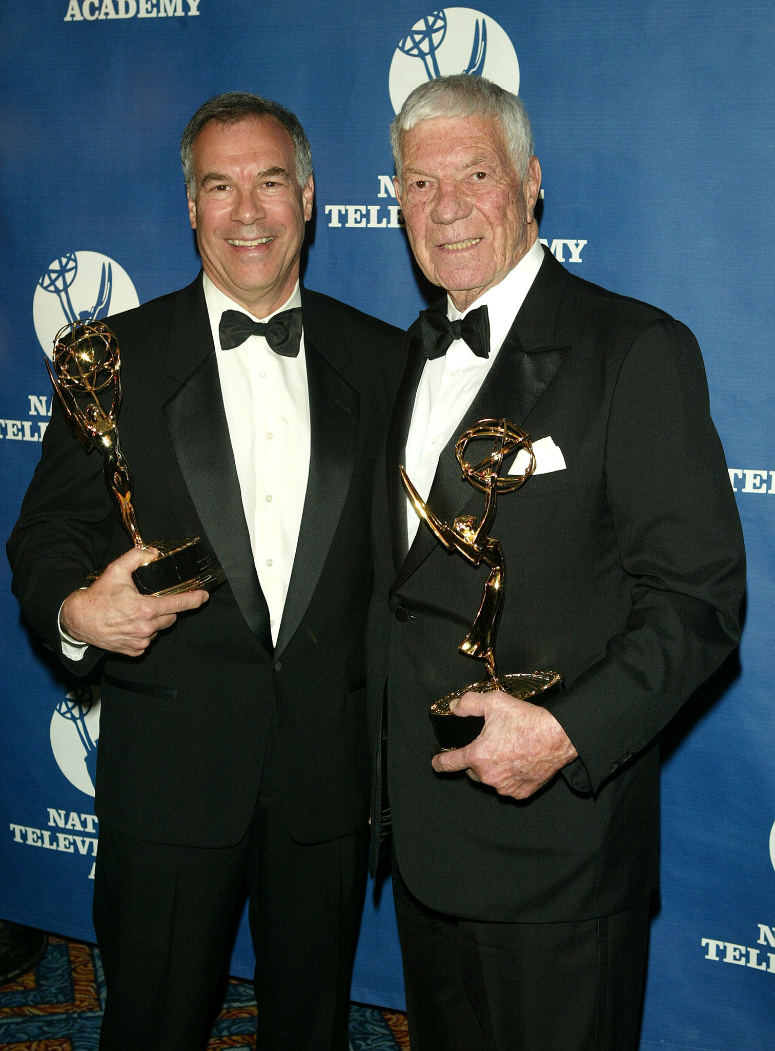NFL filmmakers Steve Sabol and Ed Sabol attend the 25th Annual Sports Emmy Awards April 19, 2004 in New York City.