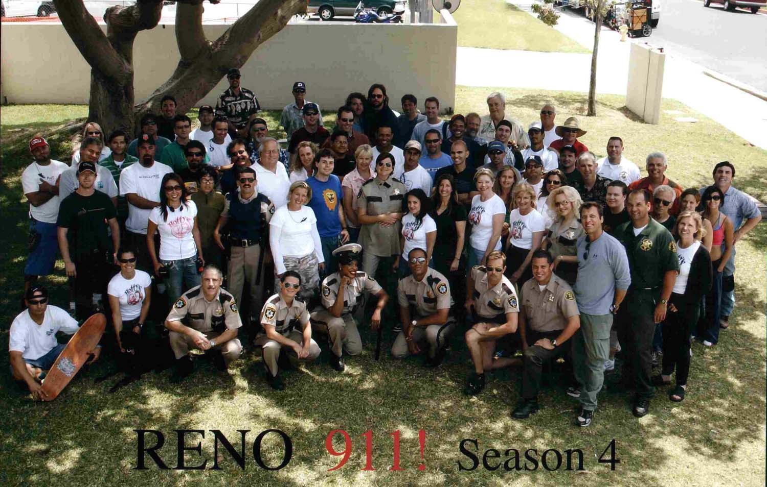 Dennis behind Ben(Deputy Travis Jr.) Reno 911 season 4