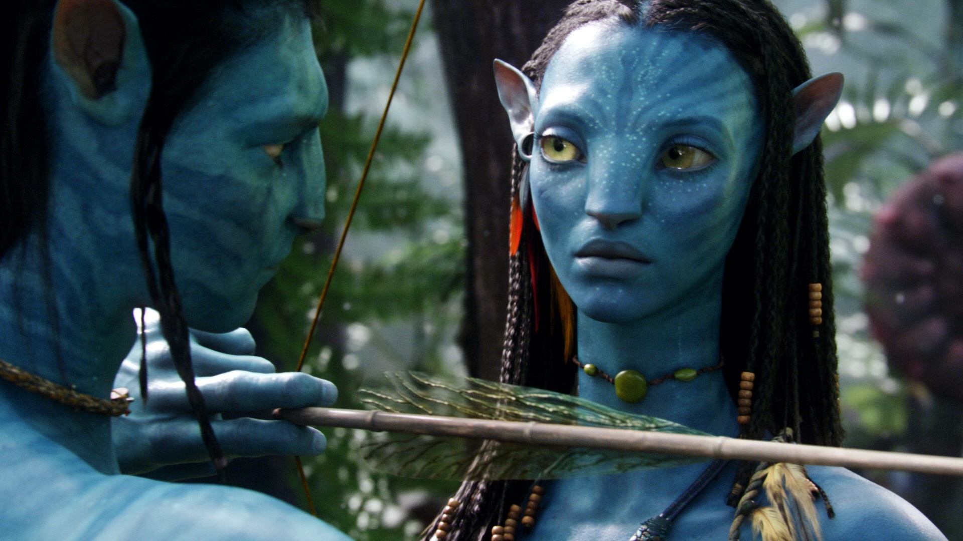 Still of Zoe Saldana and Sam Worthington in Isikunijimas (2009)