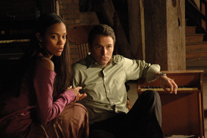 Still of Tim Daly and Zoe Saldana in The Skeptic (2009)