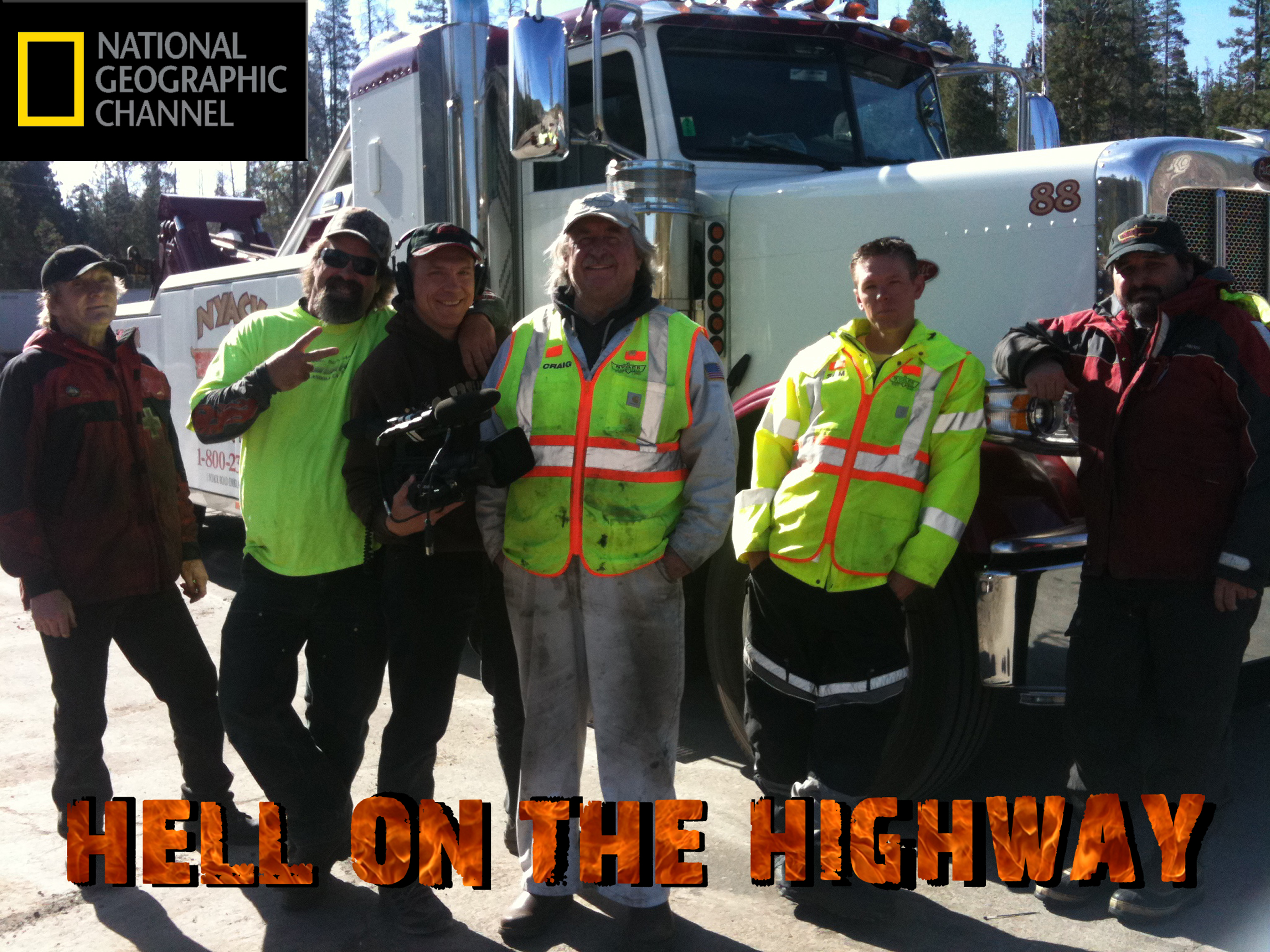 Producer Craig Santy has a lighthearted moment with the cast from Nyack Towing on the set of the National Geographic Channel's 