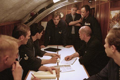 (Left to right) (hand to face, red hair) Gerrit Vooren as Voslensky, Ingvar Sigurdsson as Gorelov, Christian Camargo as Pavel, Peter Sarsgaard as Vadim, (arms crossed) James Ginty as Anatoly, Ravil Isyanov as Suslov, George Anton as Konstantin and Kristen Holden-Ried as Anton