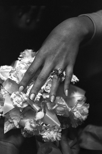 Beverly Adams showing her ring on her wedding day to Vidal Sassoon