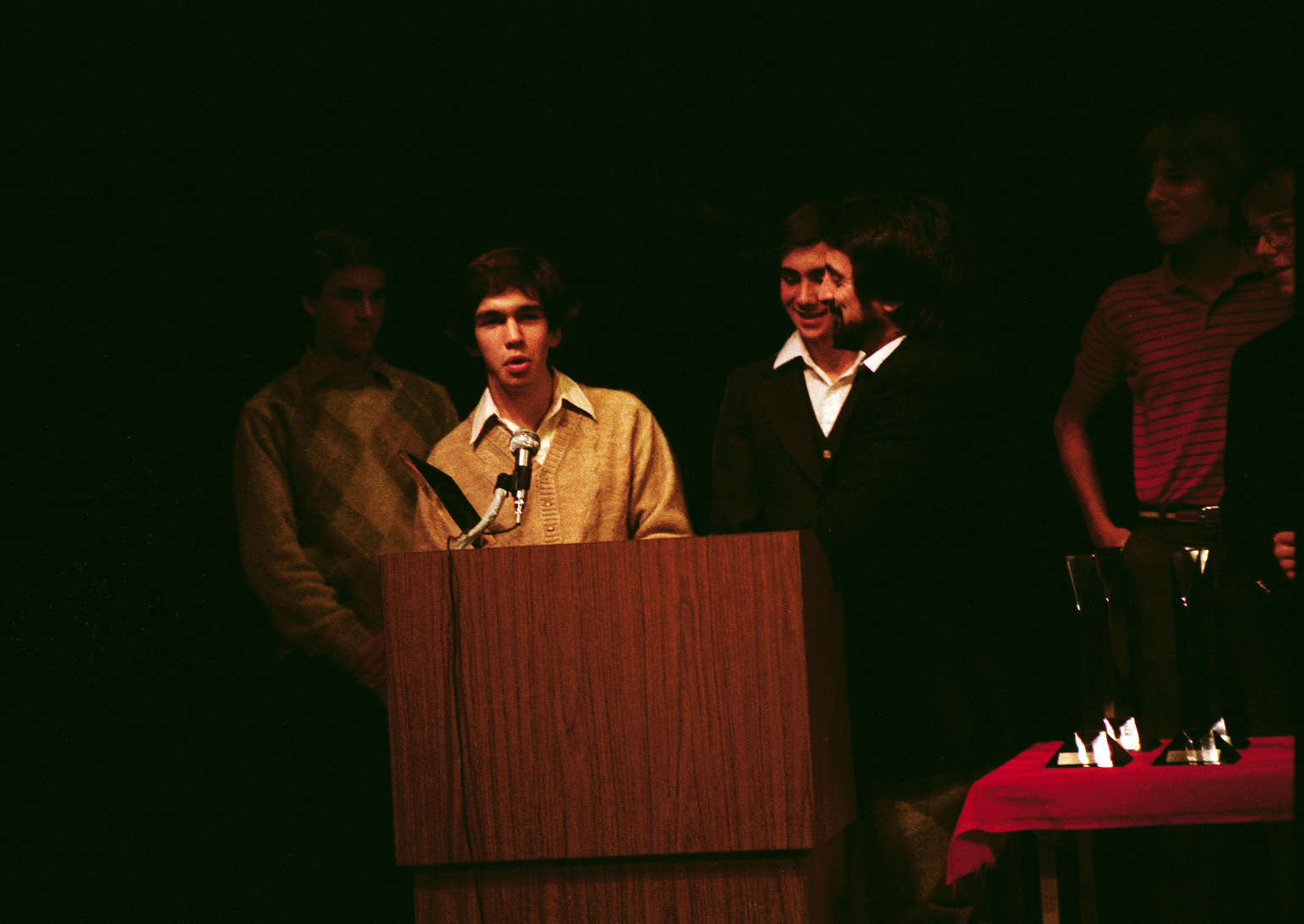 Jon Teboe accepts the Super-8 Third Place award from Tom Savini at the 1983 Cinemagic/SVA Short Film Search at Lincoln Center. Also present are the other teenage producers of 