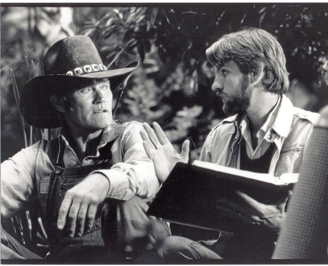 writer-director David Schmoeller and actor Chuck Connors on the set of TOURIST TRAP, 1978, Los Angeles