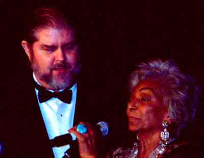 J. Neil Schulman with Nichelle Nichols, accepting 