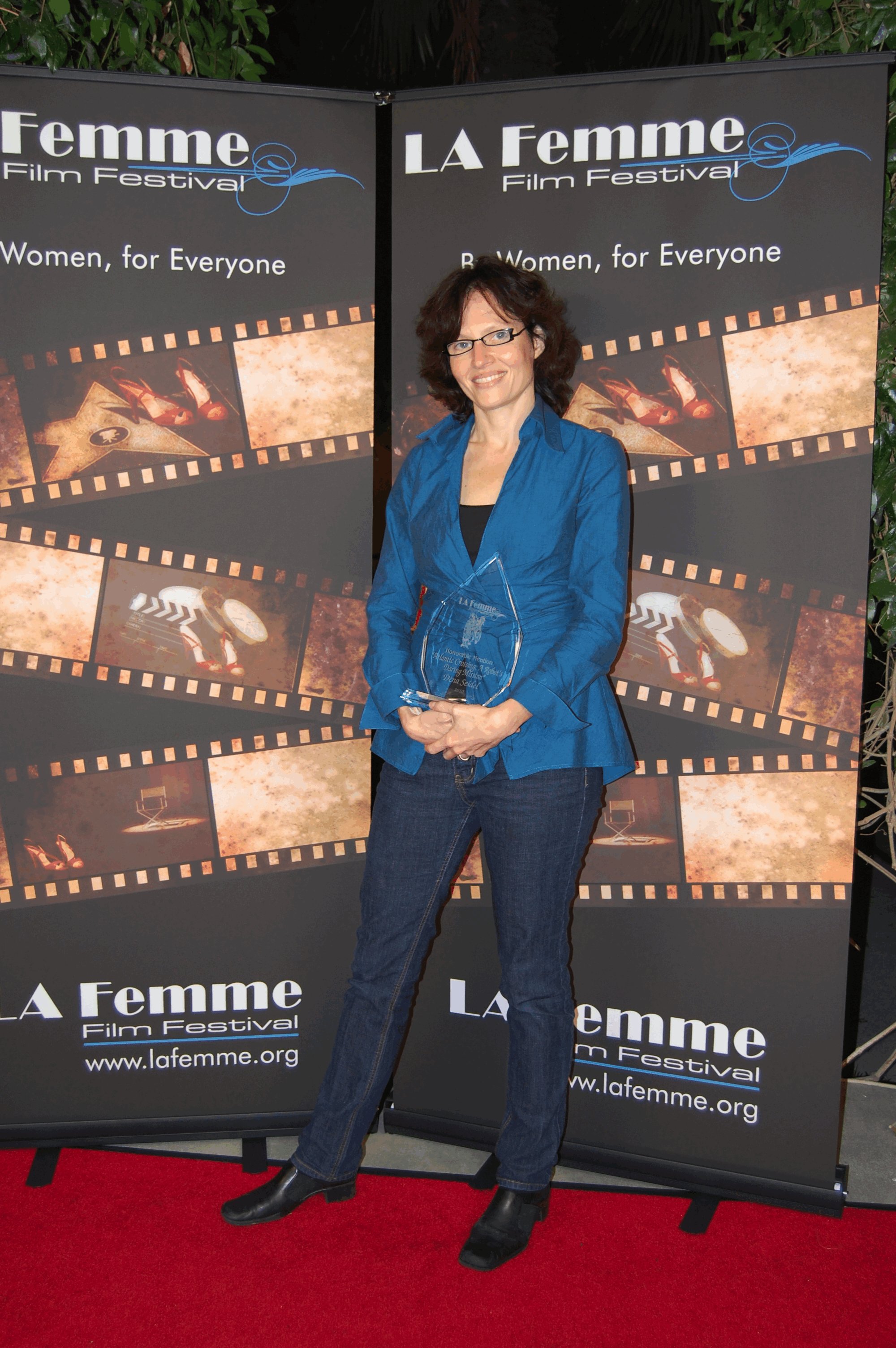 receiving award at La Femme International Film Festival