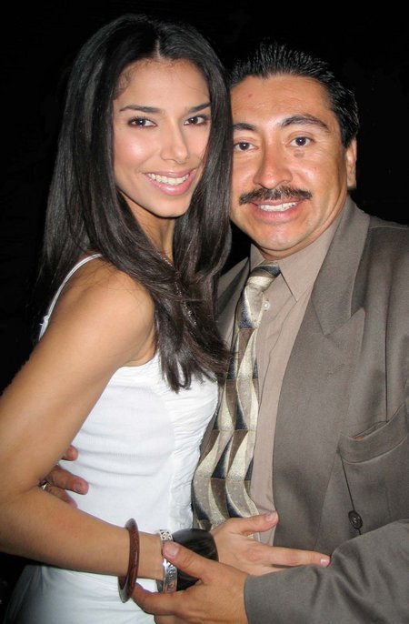 HOLLYWOOD, CA - AUGUST 14: Actress/singer Roselyn Sanchez and friend actor/photographer Alexander Sibaja pose as they are seen early morning on August 14, 2005 at Mood Night Club in Hollywood, California.