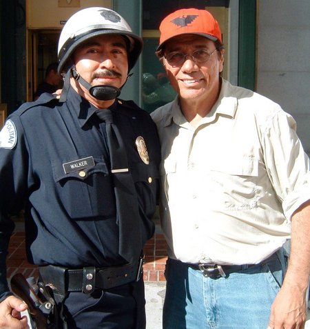 LOS ANGELES, - JULY 31: Actor/character Alexander Sibaja as a Metropolitan Los Angeles Motorcycle Police Officer and director/actor Edward James Olmos pose as they are seen filming on HBO film 