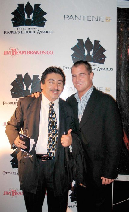 PASADENA, CA - JANUARY 9 Actor George Eads from the televison show CSI: Crime Scene Investigation and actor/photographer Alexander Sibaja pose at The 31st Annual People's Choice Awards After Party at the Twin Palms Restaurant January 9, 2005 in Pasadena, California.