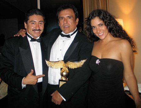 BEVERLY HILLS, CA - OCTOBER 14: Actor/photographer Alexander Sibaja (L), President Of Nosotros Jerry Velasco, and actress Yvonne De La Rosa pose as they attend private after party for the 35th Annual Nosotros Golden Eagle Awards at the Beverly Hilton Hotel on October 14, 2005 in Beverly Hills California.