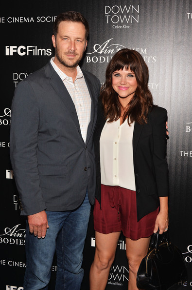 Brady Smith and Tiffani Thiessen attend the Downtown Calvin Klein with The Cinema Society screening of IFC Films' 'Ain't Them Bodies Saints' at The Museum of Modern Art on August 13, 2013 in New York City.