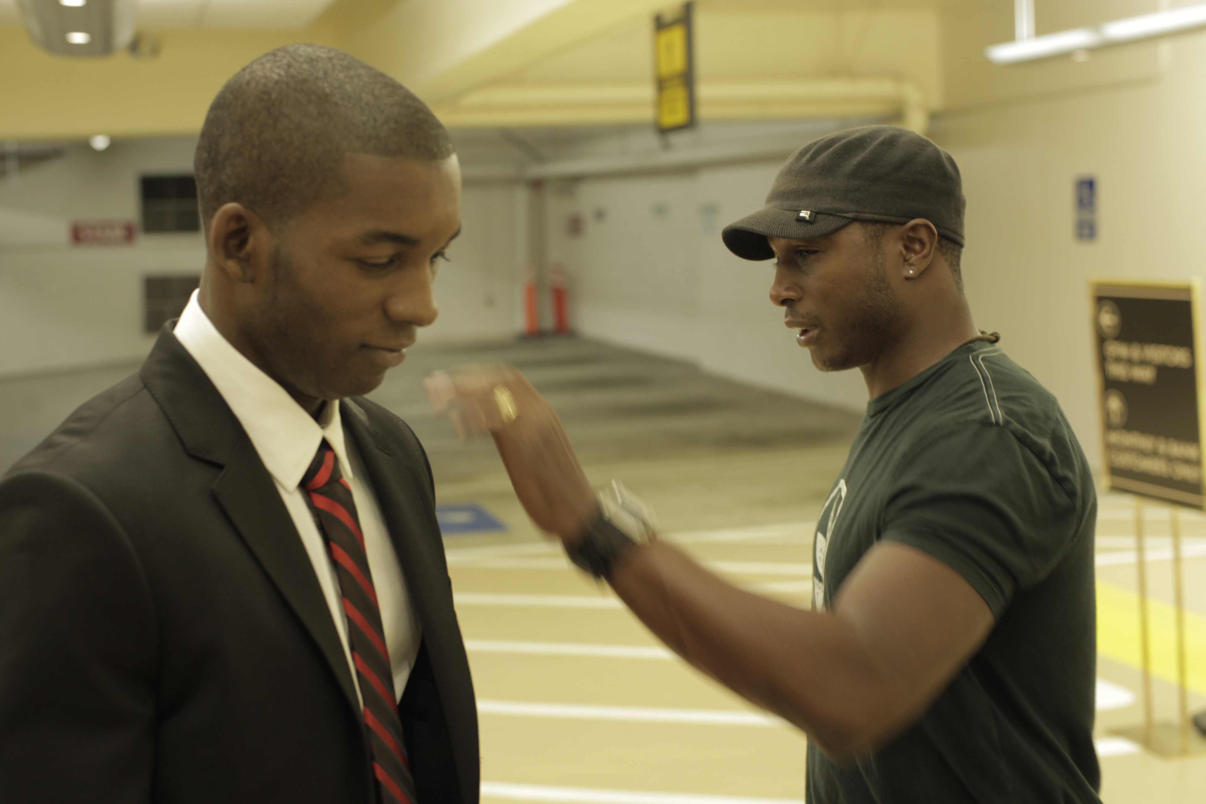 Eric Smith-Gunn gives support to Darren Thomas on the set of the film 