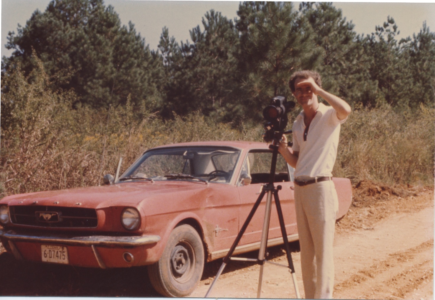 Director Ross Spears filming AGEE in Hale County, Alabama, in 1976. Film car in background.
