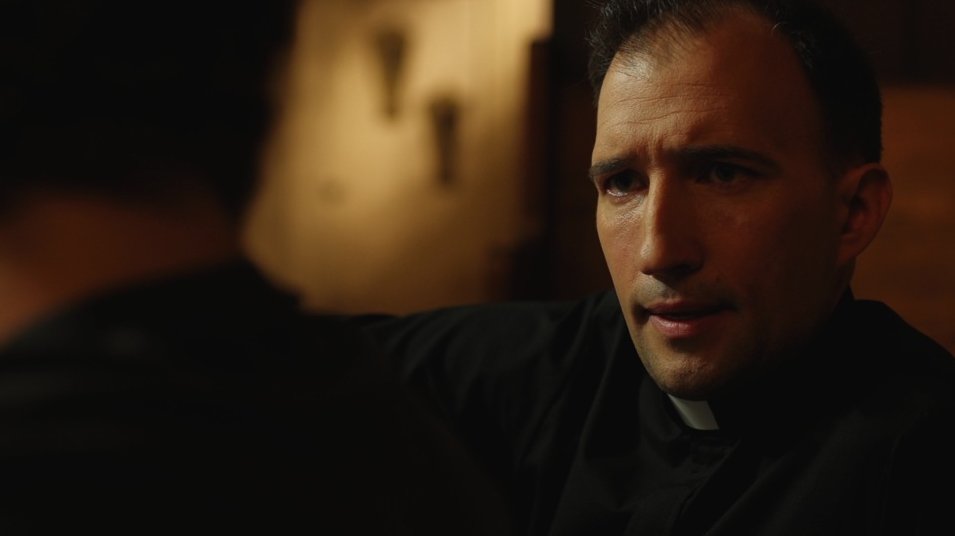 Sean Spence as Father Brian from the feature film 