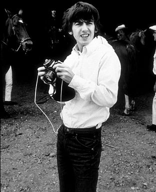 George Harrison and Ringo Starr (in background) in Ozarks, Arkansas, circa 1965.