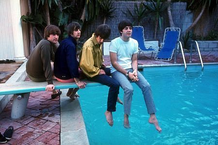 The Beatles (John Lennon, Ringo Starr, George Harrison, Paul McCartney on the diving board by the poolside)