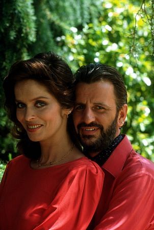 Ringo Starr holds wife Barbara in his arms from behind.