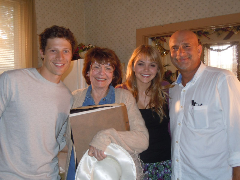 On the set of FRIDAY NIGHT LIGHTS with actors Zach Gilford and Aimee Teegarden and director Michael Waxman.