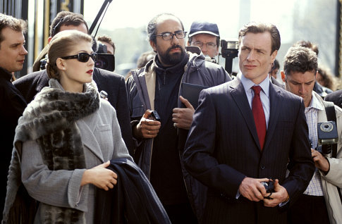 Miranda Frost (ROSAMUND PIKE) and Gustav Graves (TOBY STEPHENS) front a press conference.