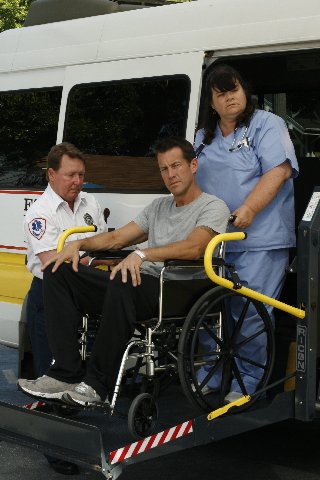 Mike Delfino (James Denton), Westeria Lane resident being taken away by Paramedic (Alan Stepp) and the hospital Nurse(?)