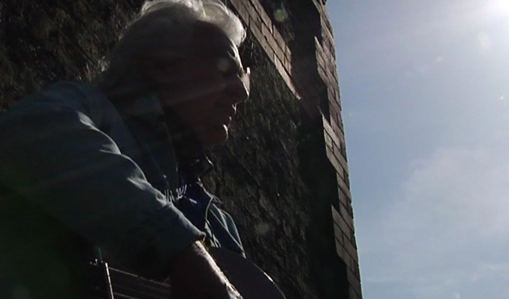 CHRIS SULLIVAN: performing his song 'The Coombe' at The Coombe, Dublin, 2009.