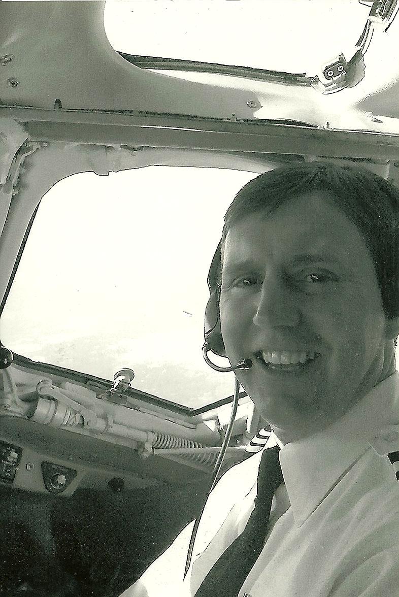 Perry D. Sullivan in the cockpit of a commercial Jet.