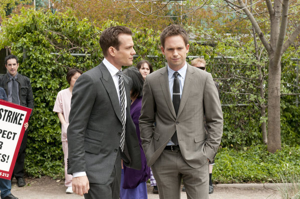 Still of Gabriel Macht and Patrick J. Adams in Suits (2011)