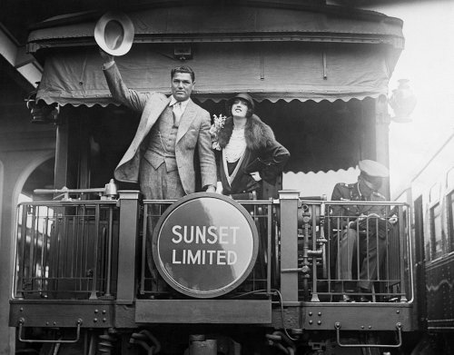 Jack Dempsey and Estelle Taylor at S.P. Station in Los Angeles as they head off to New York for his comeback fight 06-17-1927. From the Sheryl Deauville Collection.