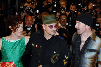 Bono, The Edge and Catherine Owens at event of U2 3D (2007)