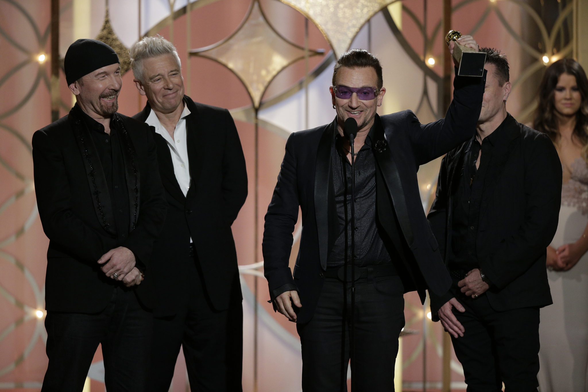 Bono, Adam Clayton, Larry Mullen Jr., The Edge and U2 at event of 71st Golden Globe Awards (2014)