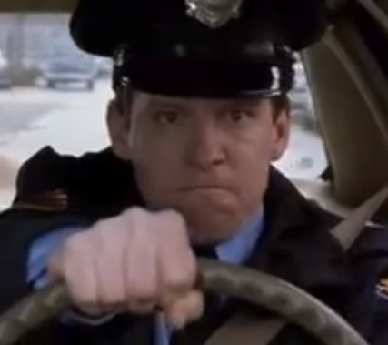 Kevin Theis as Cop O'Malley in 
