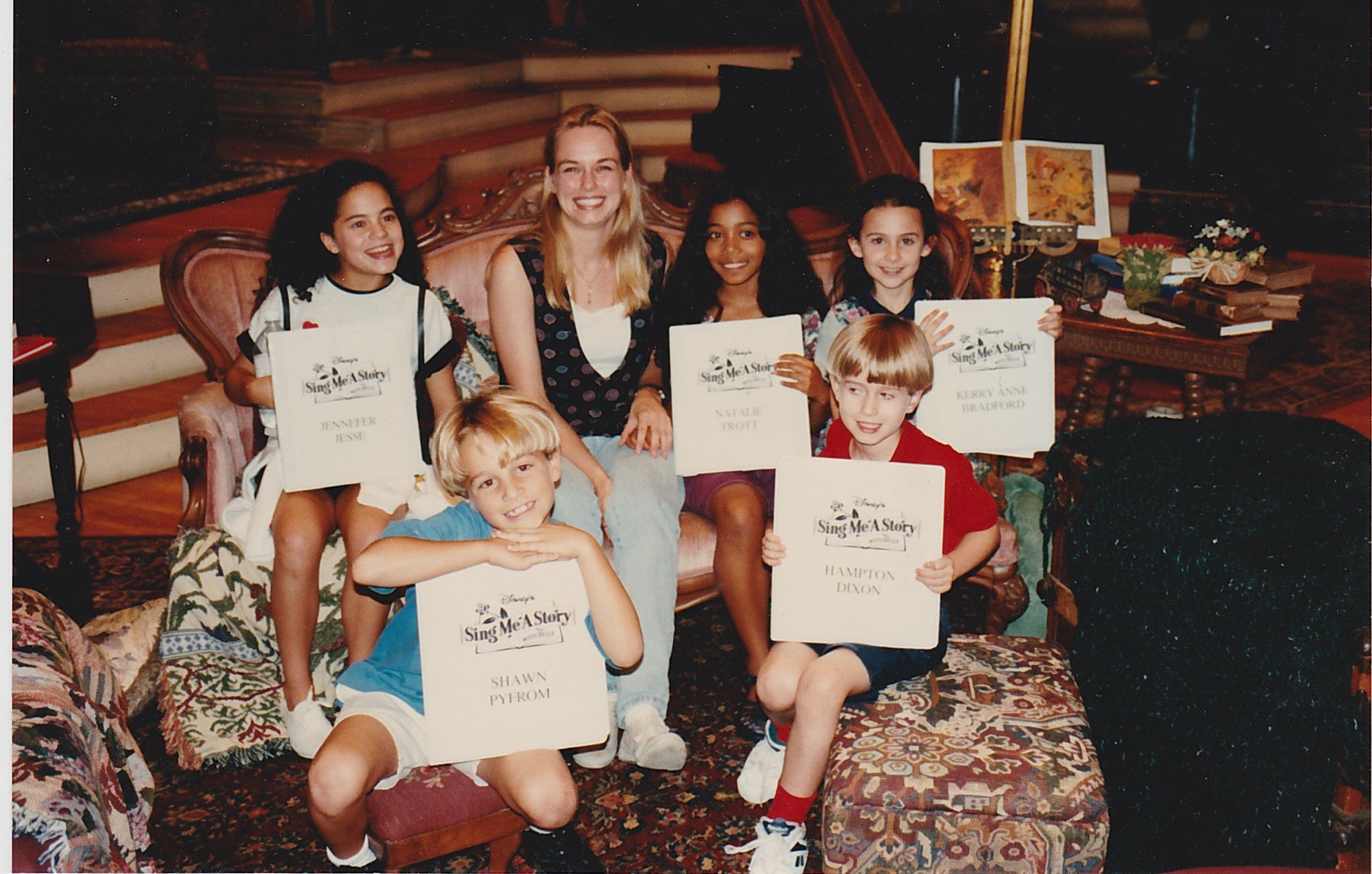 Irish Stewart with the child cast of Sing Me A Story with Belle.