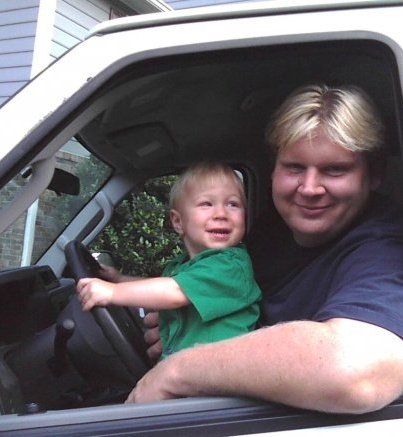 Kai Thorup with visiting son, Dax, in location van.