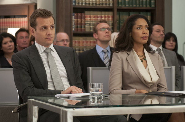 Still of Gabriel Macht and Gina Torres in Suits (2011)