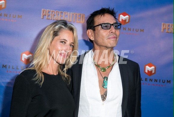 Raoul Trujillo and Michelle Martin-Coyne at Hollywood premiere of Persecuted