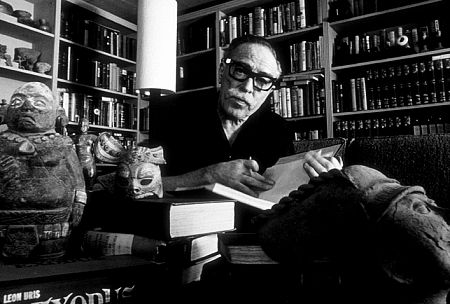 Dalton Trumbo in his office with his collection of Pre-Columbian art, 1961.