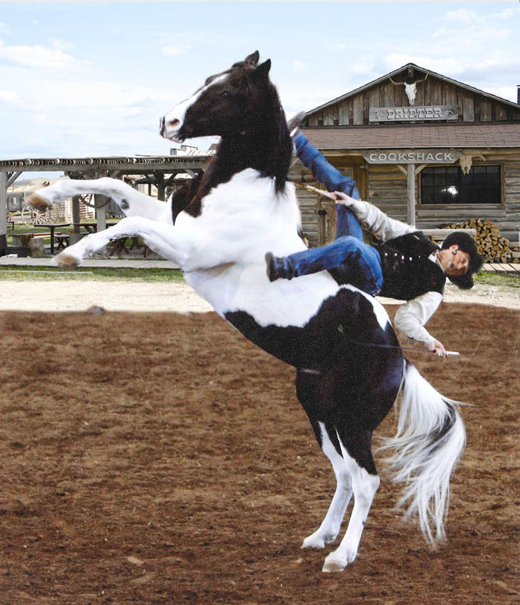Tommie Turvey performing a horse stunt with his Paint horse Joker.