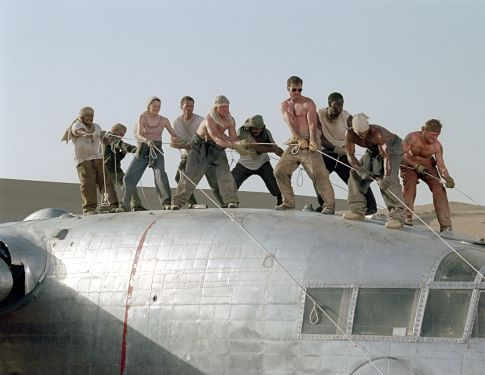 The survivors of a downed aircraft pull together to build a new plane out of the wreckage of the old one. (L to R) Jacob Vargas, Giovanni Ribisi, Miranda Otto, Hugh Laurie, Scott Michael Campbell, Kevork Malikyan, Dennis Quaid, Tyrese Gibson, Kirk Jones and Tony Curran.