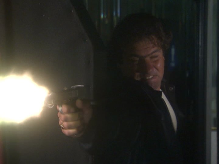 Still of Craig Vincent shooting it out with Robert Davi in HITTERS (2002)