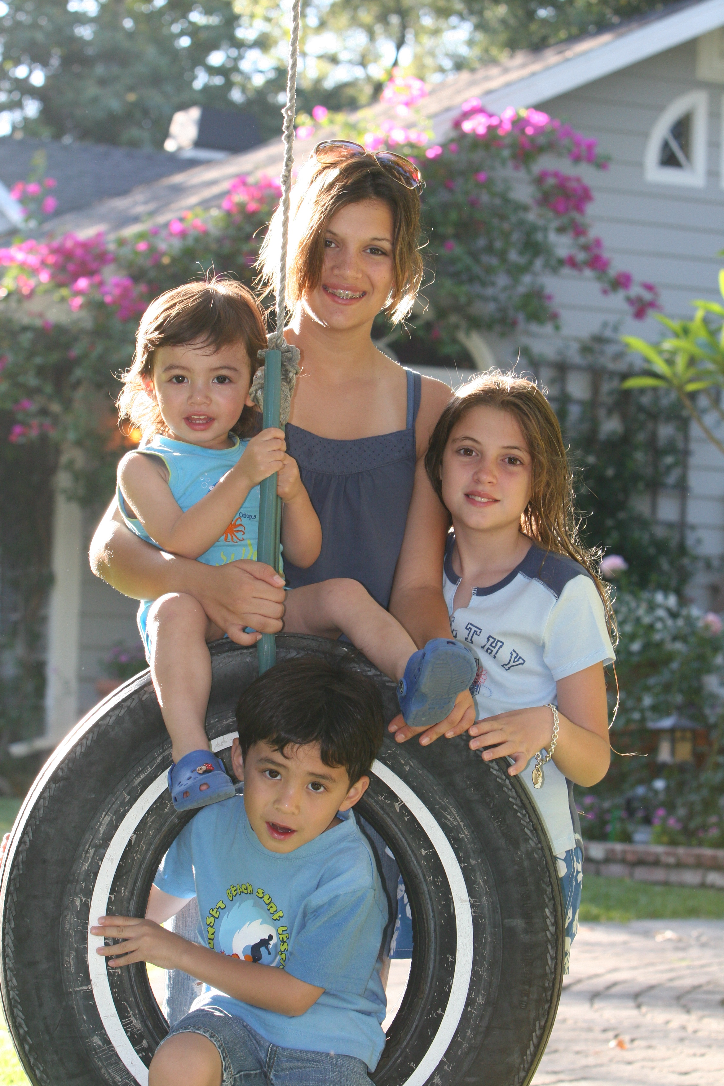 Stefan's 4 children. Odin (left), Brittany(center), Kaila(right) and Gunnar (bottom of frame in the tire)