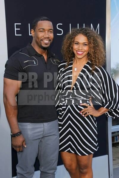 Michael Jai White and fiancée Gillian Waters at the premiere of Elysium in Westwood, CA.