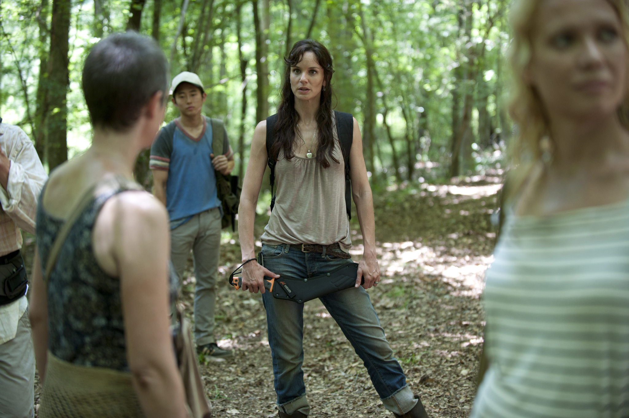 Still of Laurie Holden, Melissa McBride, Sarah Wayne Callies and Steven Yeun in Vaiksciojantys negyveliai (2010)