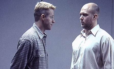 John Frazier as Ron (r), counseling - and secretly cruising -- Troy (Derik Webb, l)