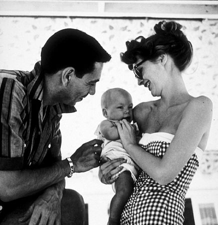 Jack Webb with his wife, Julia London, and baby at home, 1953.