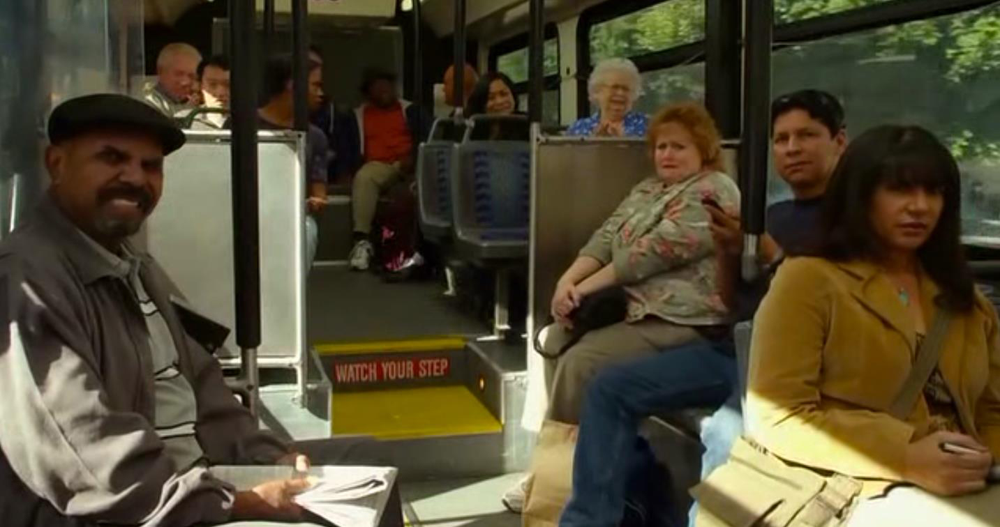 A still of Tracy Weisert on the bus in THE MUPPETS as Walter screams