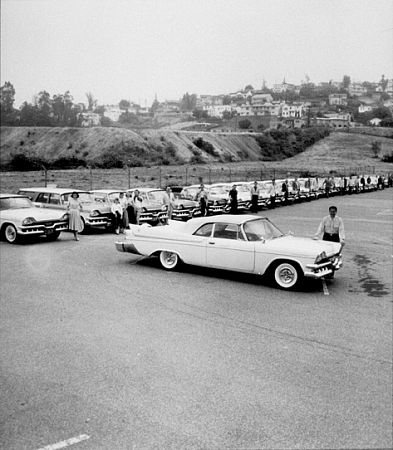 Lawrence Welk and his band with cars donated by his sponsor, Chrysler, 1958.
