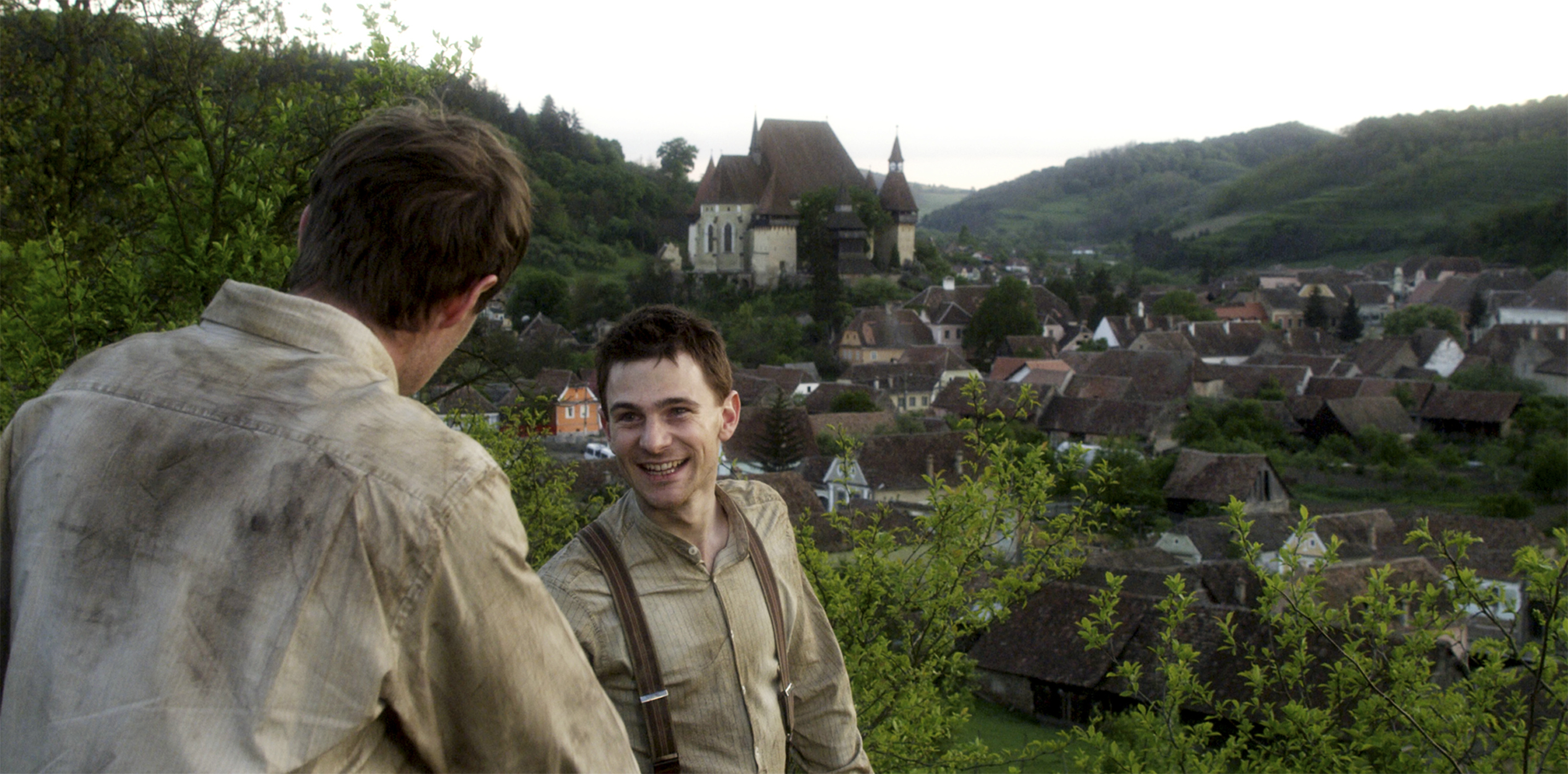 Still of Mark Wells and Jonas Armstrong in Walking with the Enemy (2013)