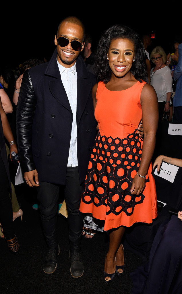 Actor Eric West and actress Uzo Aduba attend the Vivienne Tam fashion show during Mercedes-Benz Fashion Week Spring 2015 at The Theatre at Lincoln Center on September 7, 2014 in New York City.