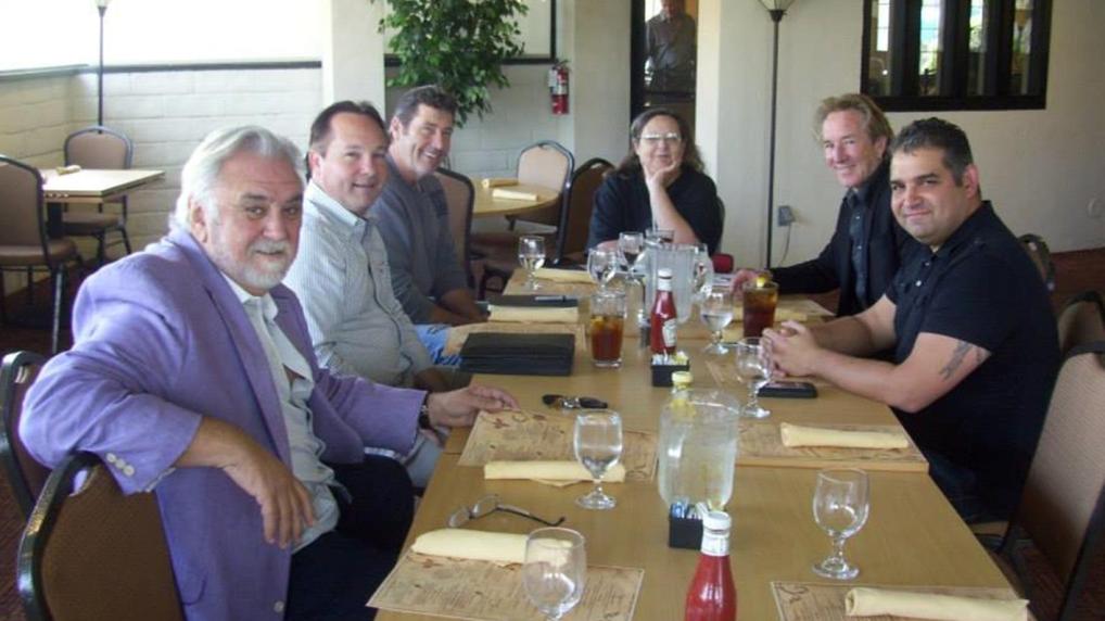 Meeting with directors Rod Hardy (purple jacket) and Larry McLean (to Cheryl's left) on several projects.